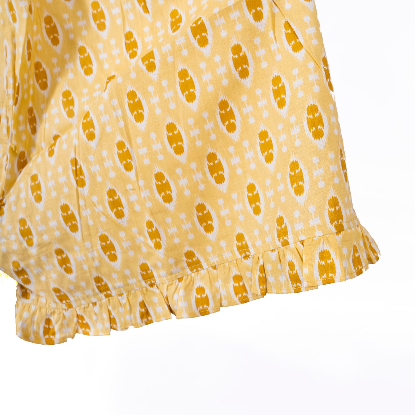 yellow ikat print shorts with frilly hem